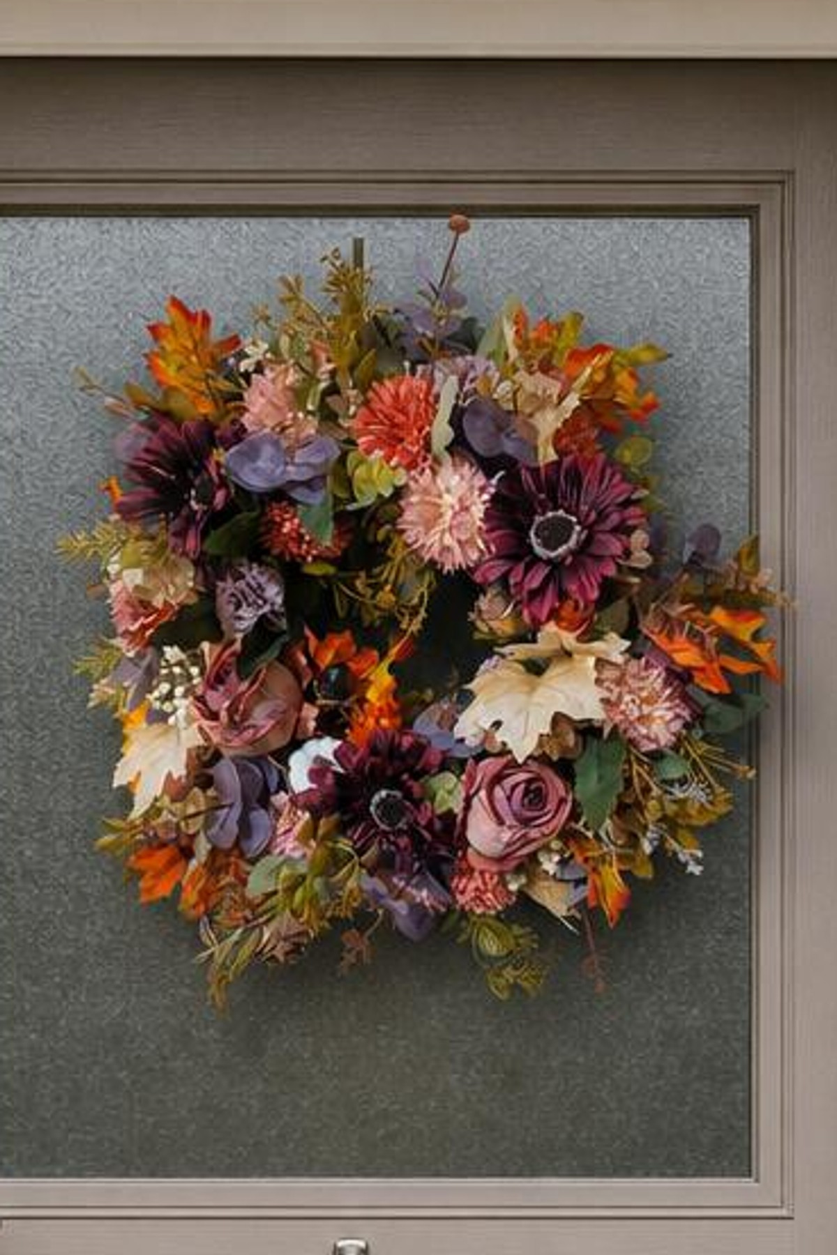 Burgundy Gerbera and Rusts collide close up